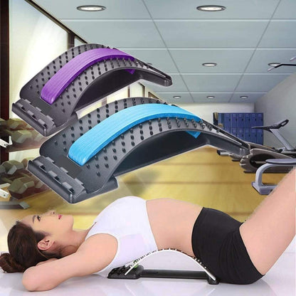 Lumbar Tractor Therapy device with magnetic massage points used for back pain relief and spine support in a gym setting.