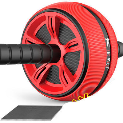 Red abdominal exercise roller with textured surface and included knee pad for comfortable home fitness sessions.