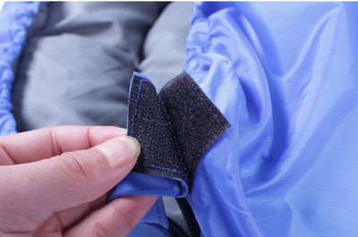 Close-up of velcro strap on Camping Sleeping Bag - Light Waterproof, highlighting secure closure and durable polyester material.