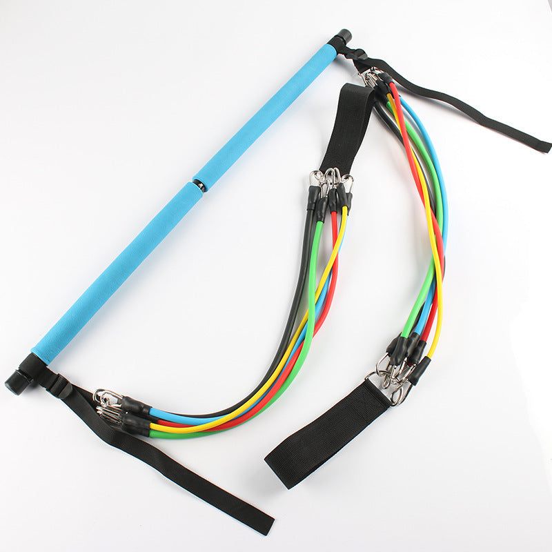 Blue Pilates bar with multicolor resistance bands and foot straps, ideal for home trainer workout equipment and full-body exercises.